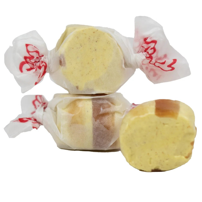 yellow and brown taffy wrapped in white paper