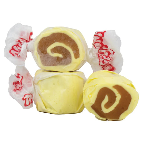 yellow and brown taffy candies wrapped in white paper