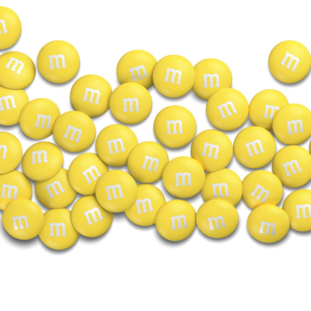 M&M's candy on the yellow background, colorful candy and